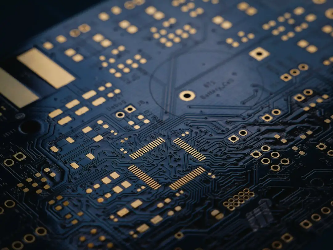 Close-up of a green circuit board with copper traces, representing low-level hardware optimization.