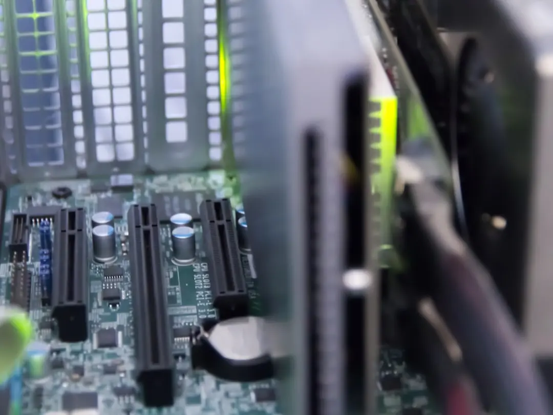 Close-up of a server motherboard showing CPU sockets and memory slots