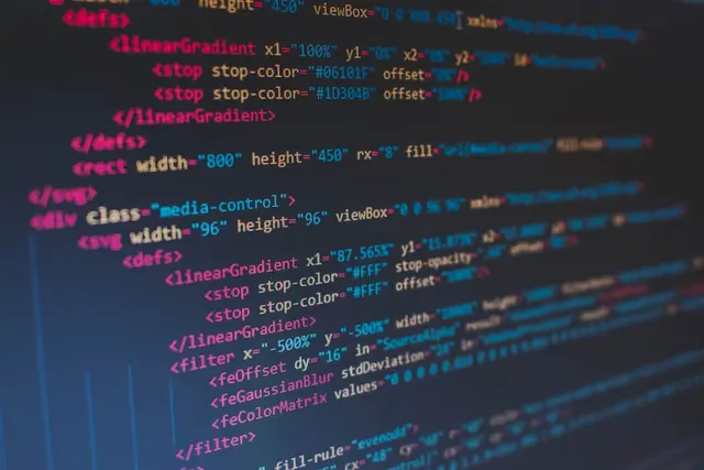 Close-up of TypeScript code in a syntax-highlighted editor with blue type annotations.